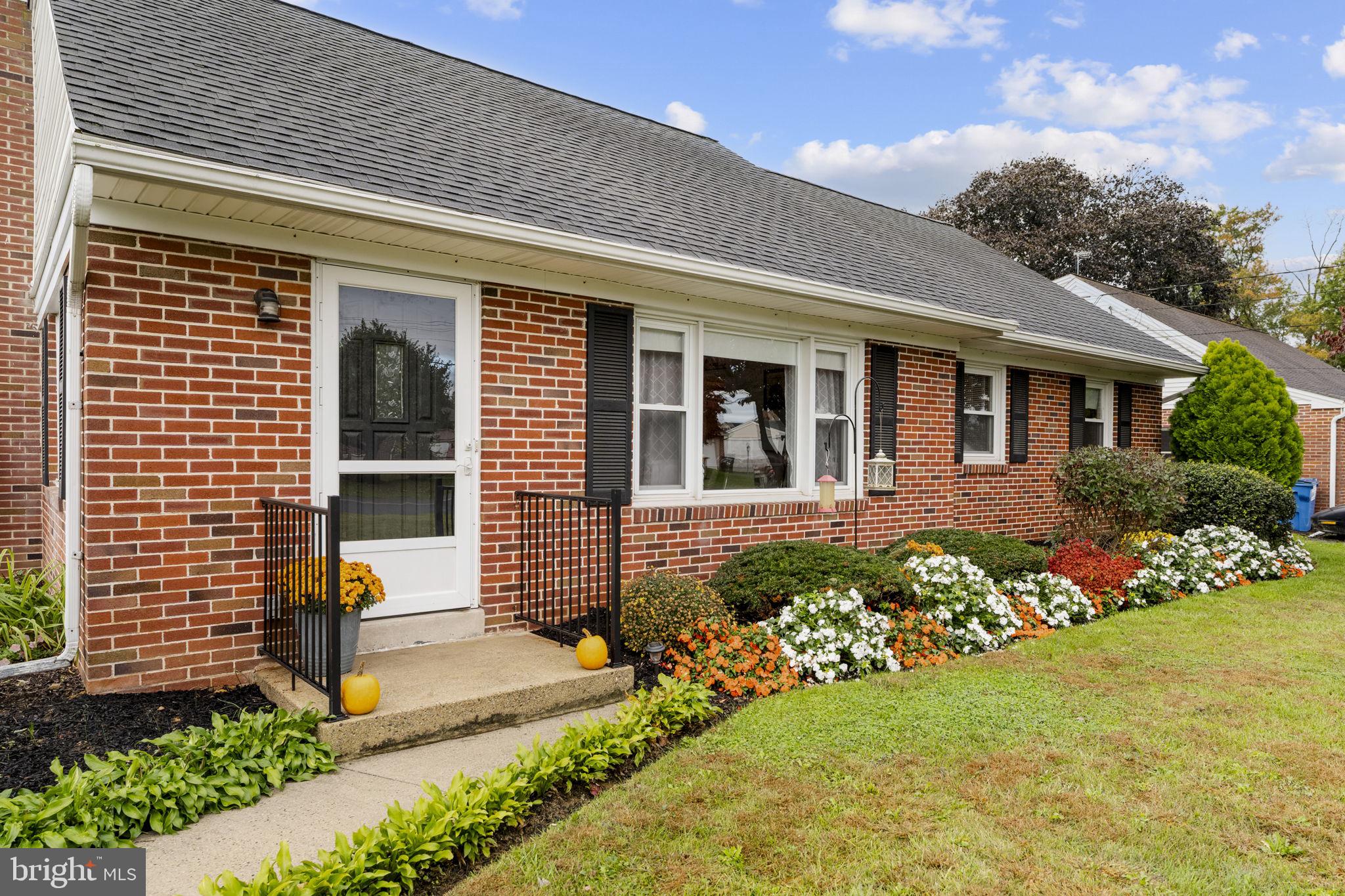 210 Musser Road East Earl, PA 17519 - Photo 2 of 44 a front view of a house with a yard