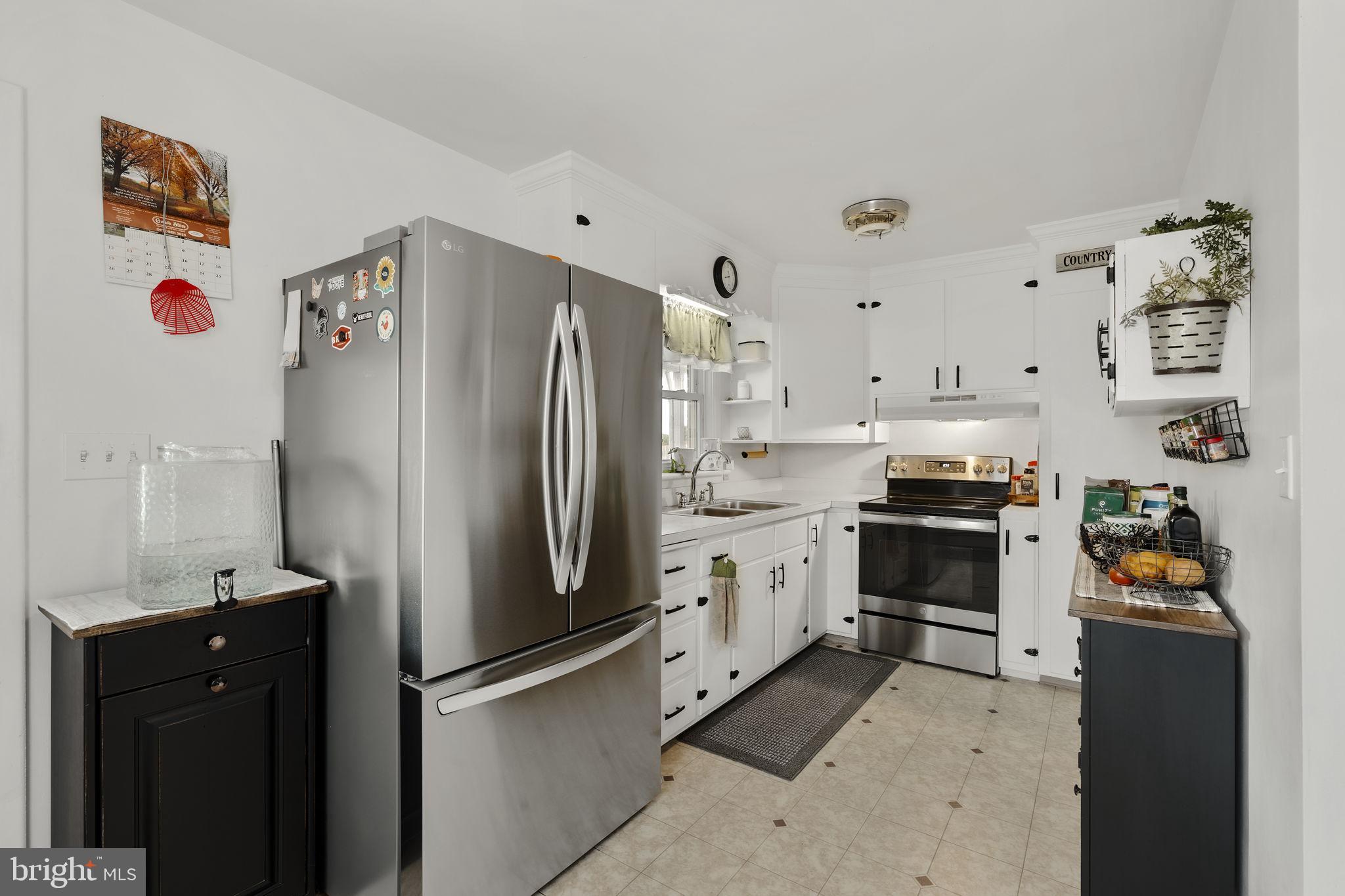 210 Musser Road East Earl, PA 17519 - Photo 21 of 44 a kitchen with stainless steel appliances a refrigerator sink and stove