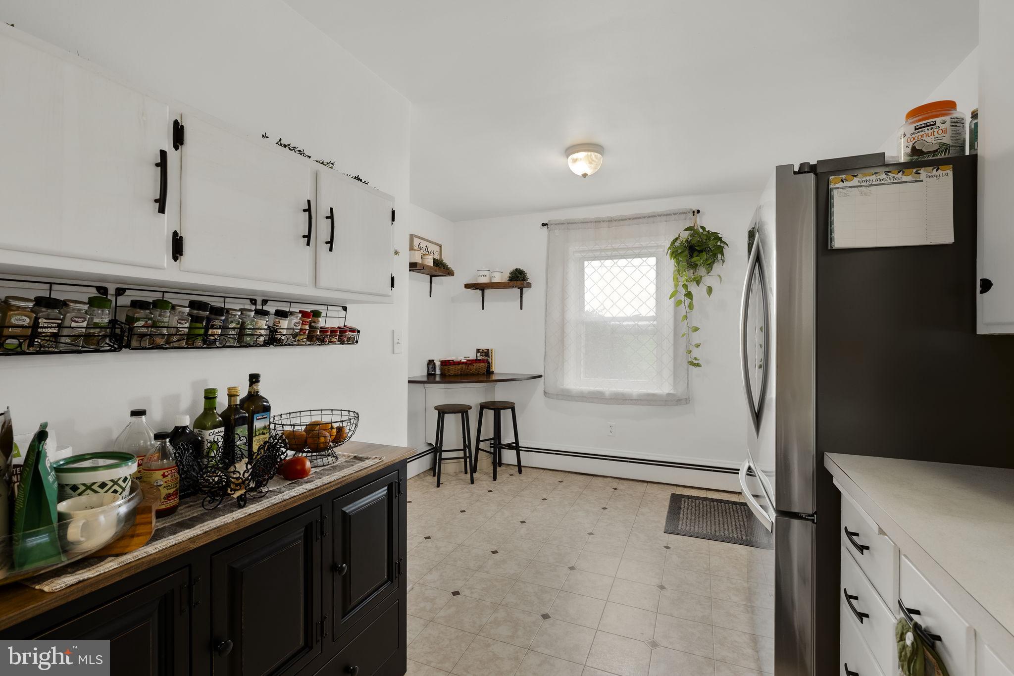 210 Musser Road East Earl, PA 17519 - Photo 23 of 44 a kitchen with stainless steel appliances granite countertop a refrigerator and a sink