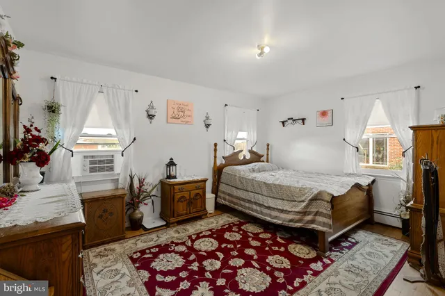 a bedroom with a bed and a table