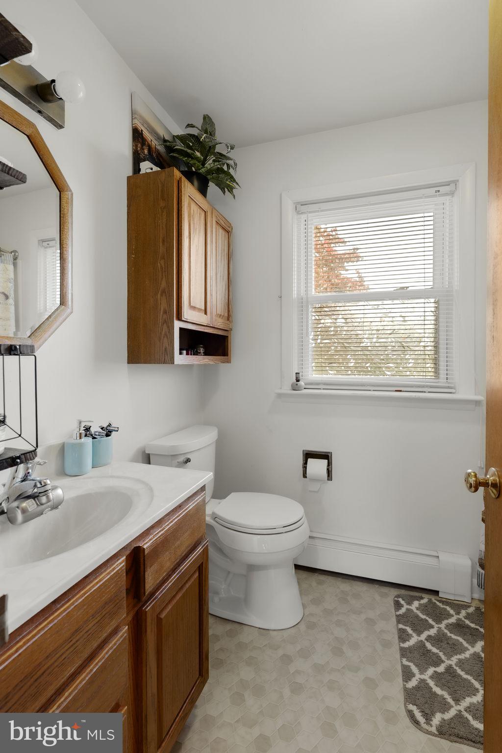 210 Musser Road East Earl, PA 17519 - Photo 30 of 44 a bathroom with a toilet sink and mirror
