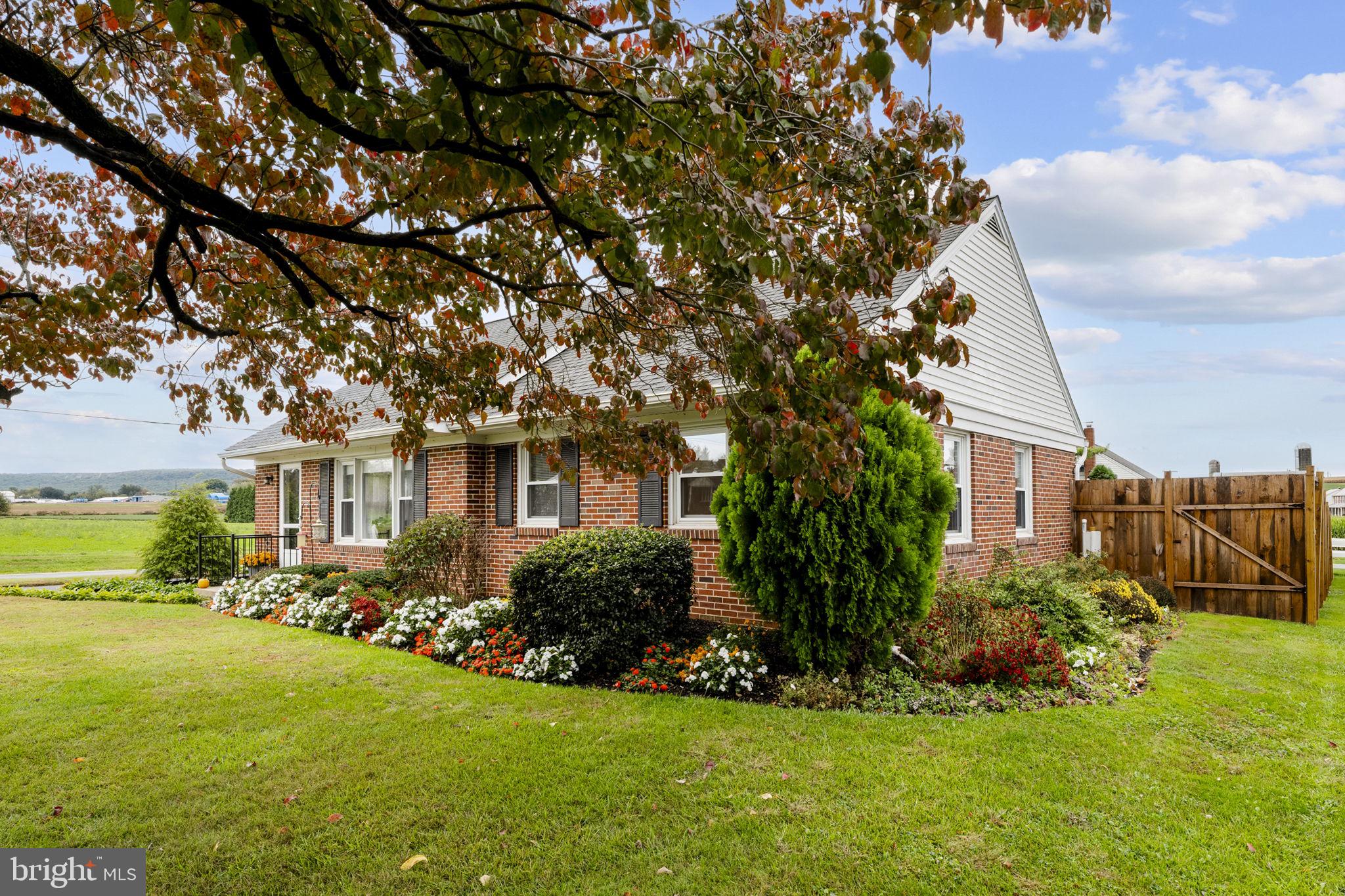 210 Musser Road East Earl, PA 17519 - Photo 4 of 44 a front view of house with yard and green space