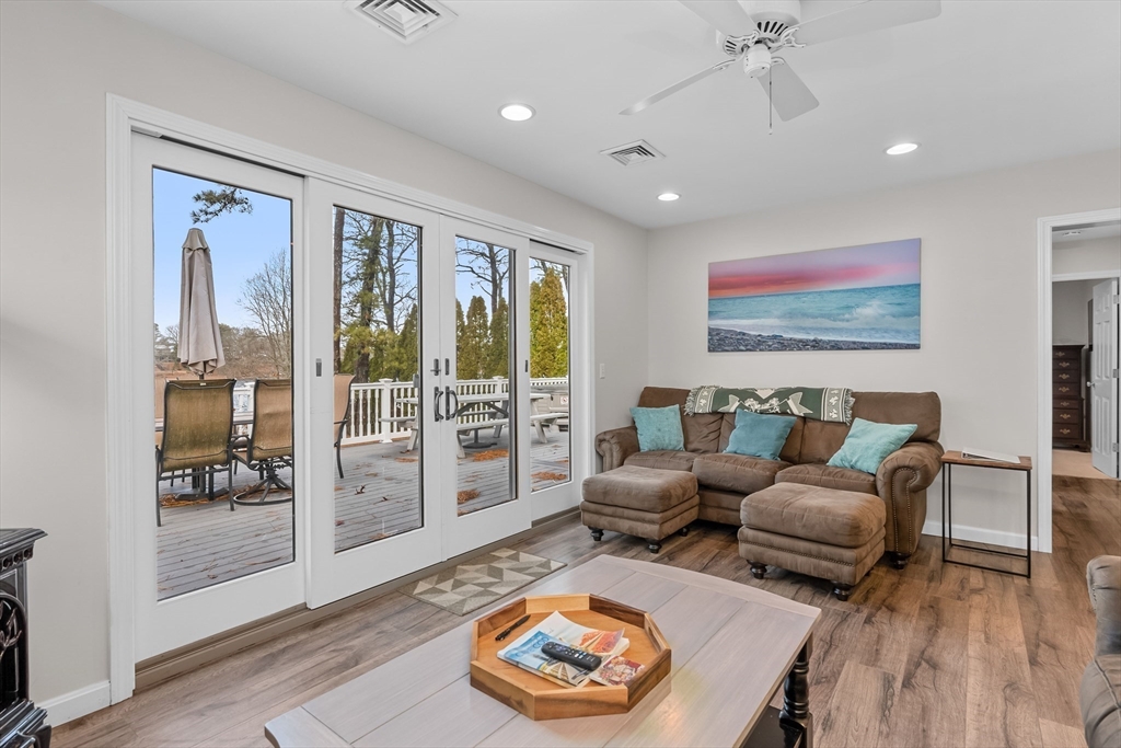 17 Maple Street Bourne, MA 02532 - Photo 14 of 33 a living room with furniture and a floor to ceiling window