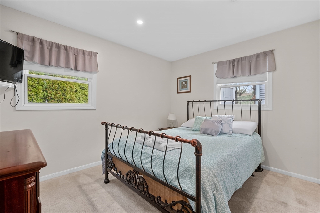 17 Maple Street Bourne, MA 02532 - Photo 24 of 33 a bedroom with a bed and a window