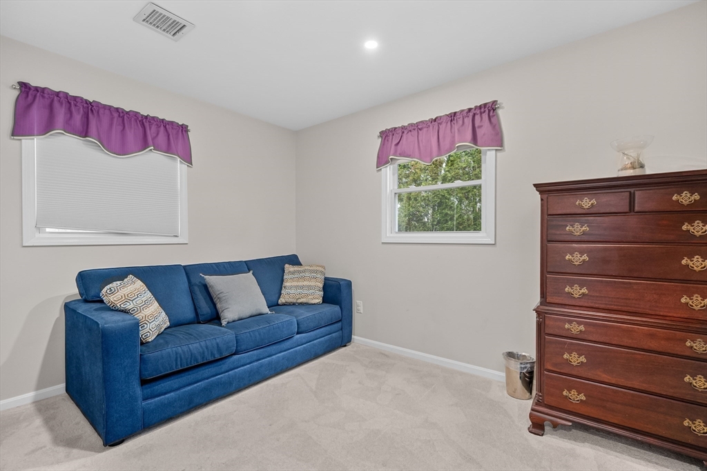 17 Maple Street Bourne, MA 02532 - Photo 25 of 33 a living room with furniture and a window