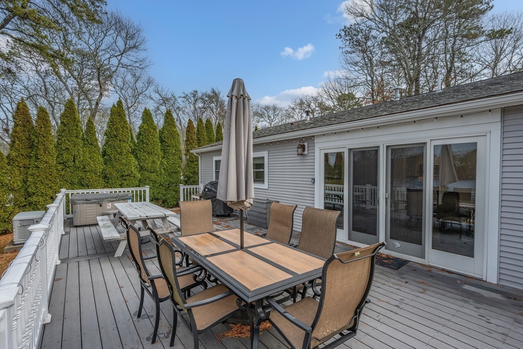 17 Maple Street Bourne, MA 02532 - Photo 26 of 33 a view of a patio with a table and chairs
