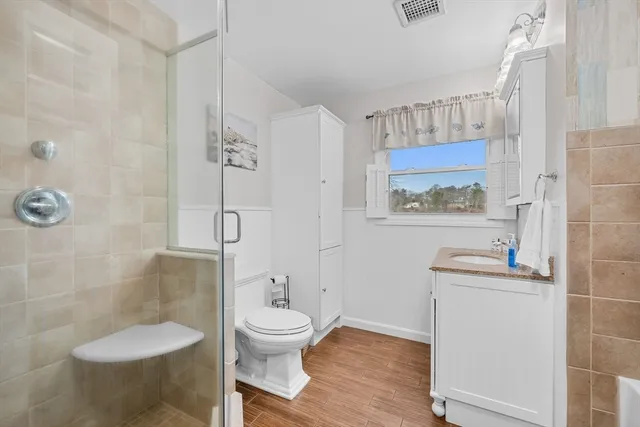 a bath tub sitting next to a white sink
