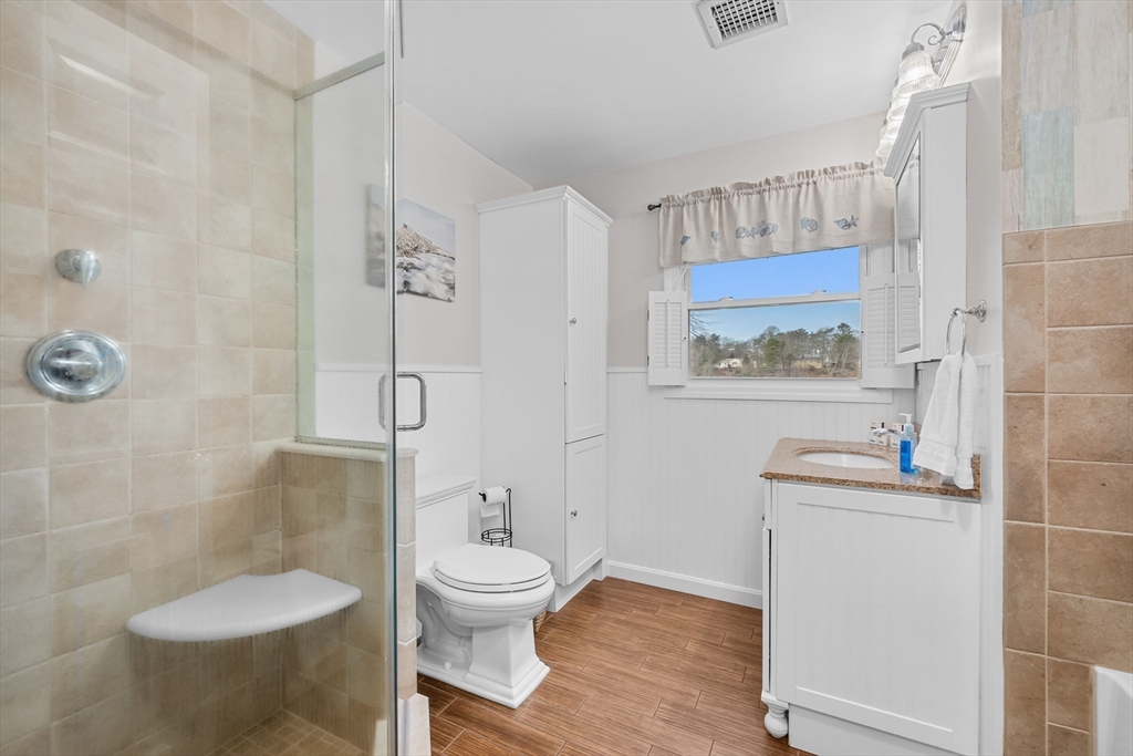 17 Maple Street Bourne, MA 02532 - Photo 27 of 33 a bathroom with a toilet sink and shower