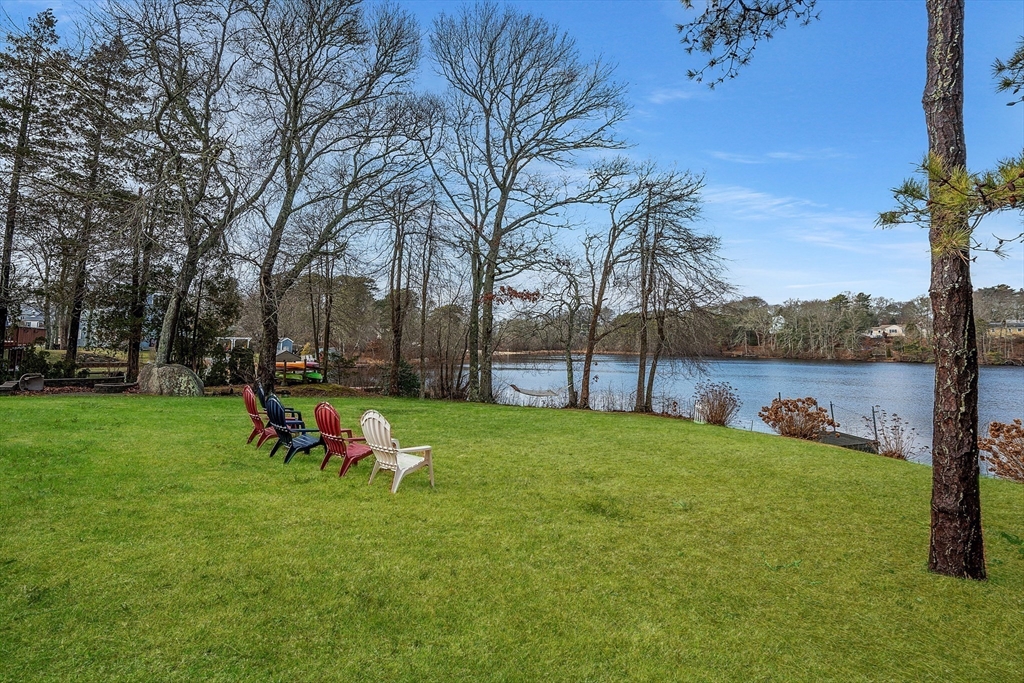 17 Maple Street Bourne, MA 02532 - Photo 7 of 33 a garden with wooden fence