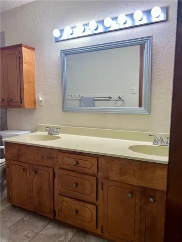 a white toilet sitting next to a shower curtain