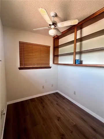 a workspace with furniture and a potted plant