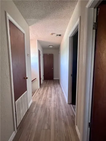 a view of a livingroom with a ceiling fan and a projector