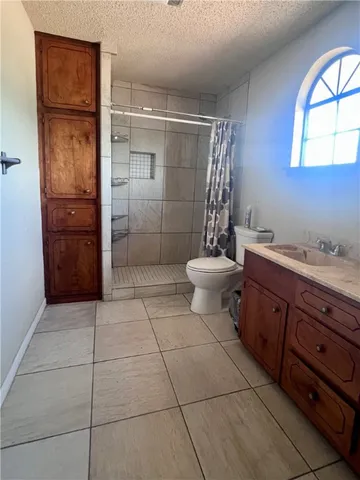 an empty room with furniture and window