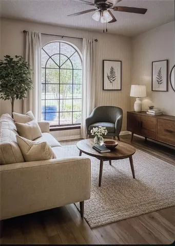 a living room with furniture and a large window