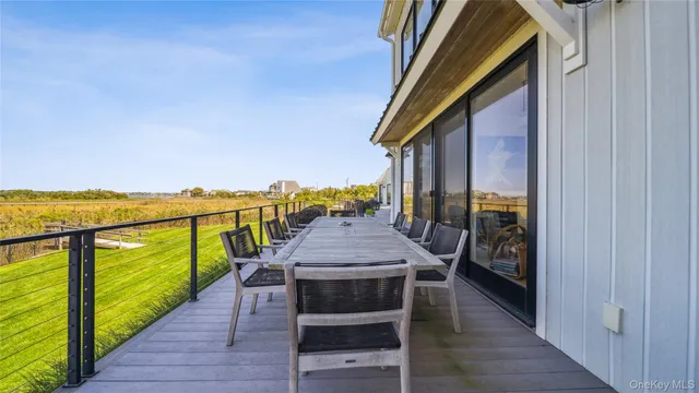 a balcony with furniture and a garden