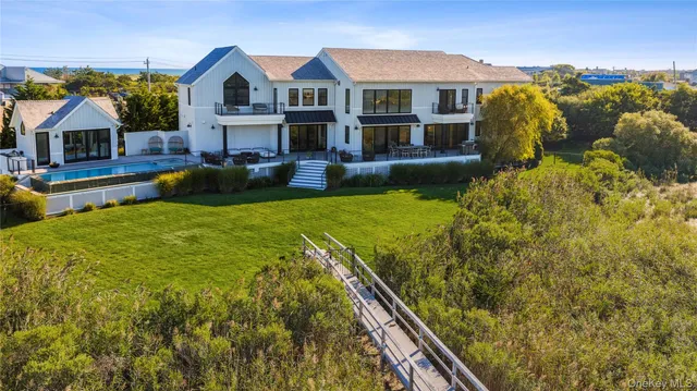 a view of a house with a yard and plants