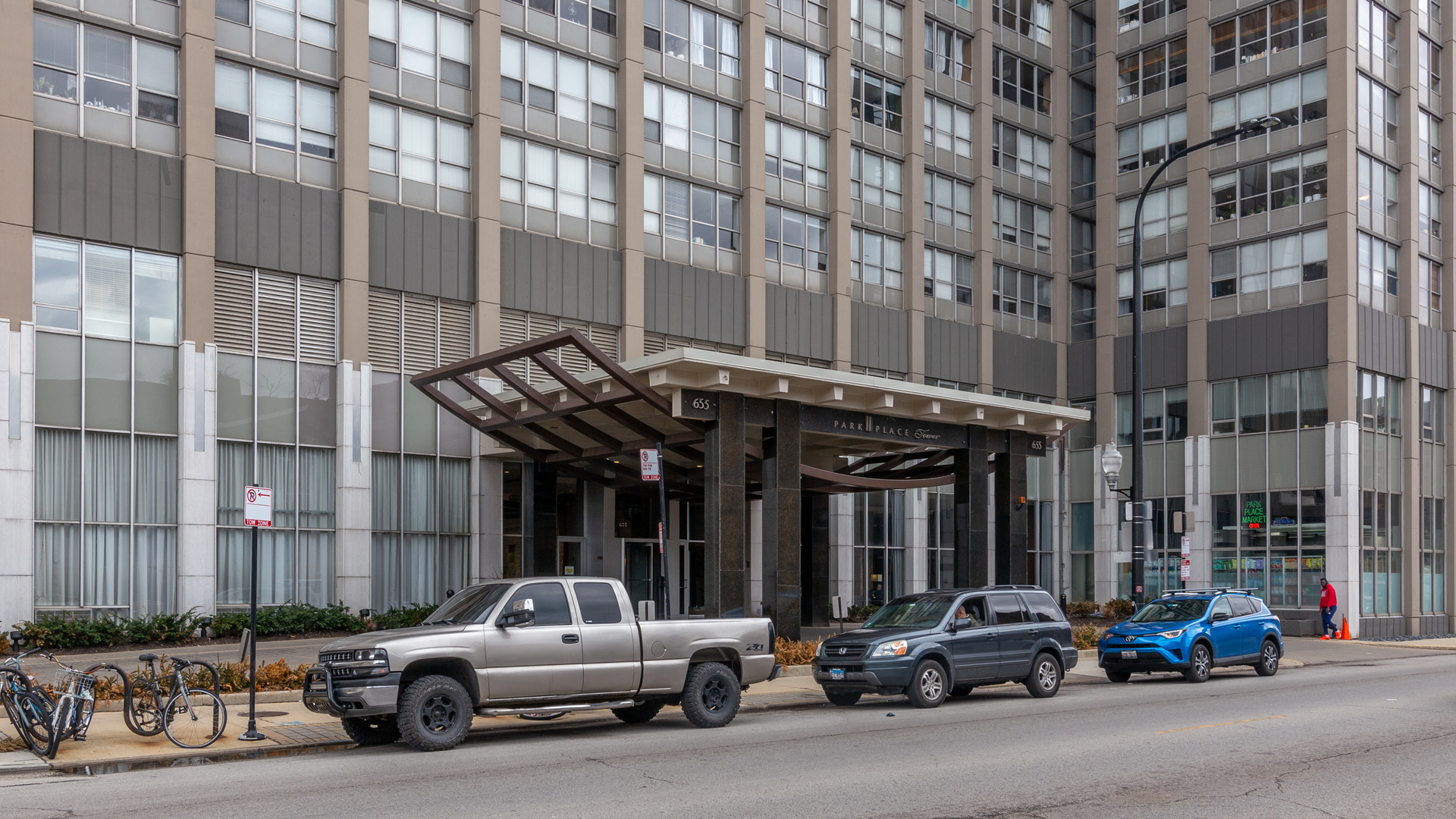 655 West Irving Park Road, Unit 1607 Chicago, IL 60613 - Photo 1 of 1 a car parked in front of building