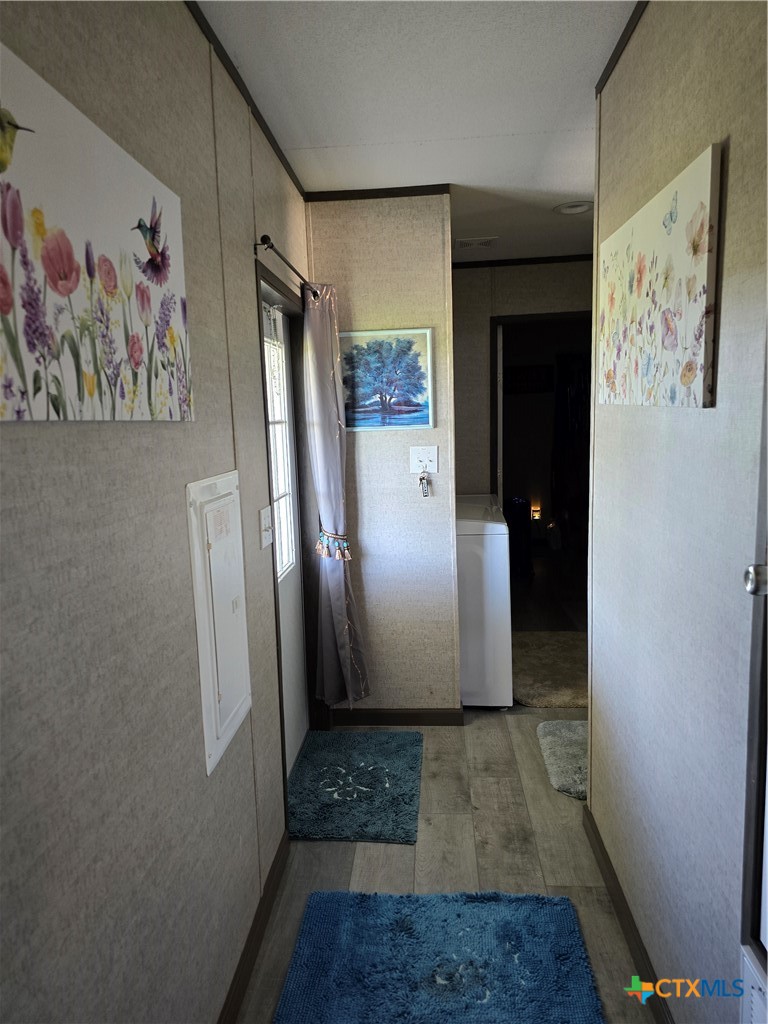 412 Coryell City Road Gatesville, TX 76528 - Photo 22 of 34 a view of a hallway with paintings on the wall
