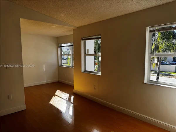 a view of empty room with windows