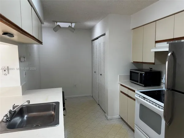 a utility room with washer and dryer