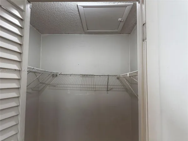 a view of a room with racks on the wall