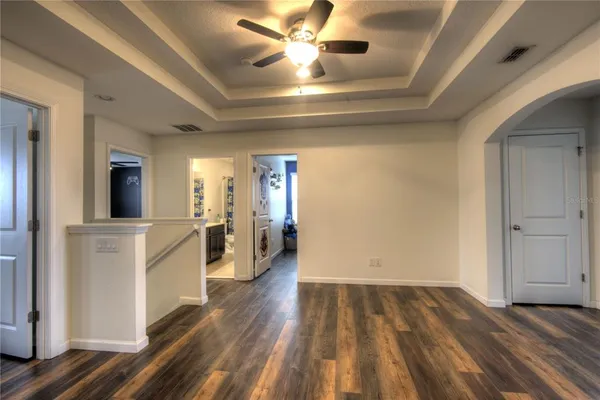 a view of a refrigerator in kitchen and wooden floor