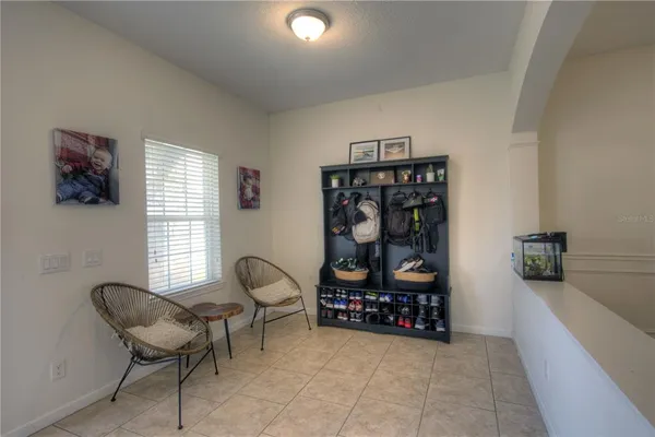 a room with furniture a rug and a window