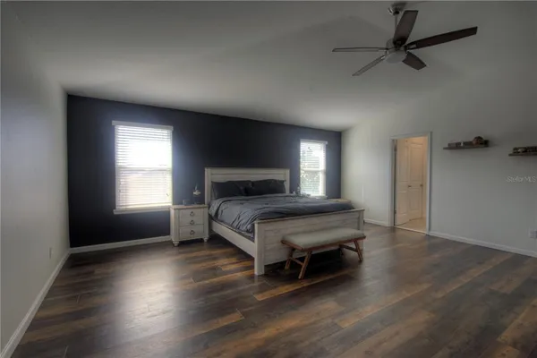 a living room with a bed furniture and a window