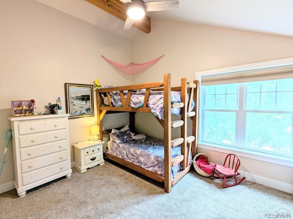 10 Robert Road Rye, CO 81069 - Photo 19 of 50 a bedroom with a bed and a couch