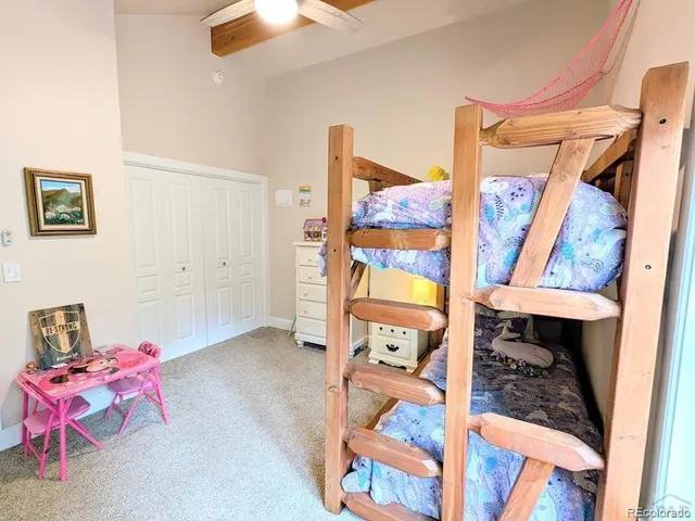 a view of deck with table and chairs and potted plants