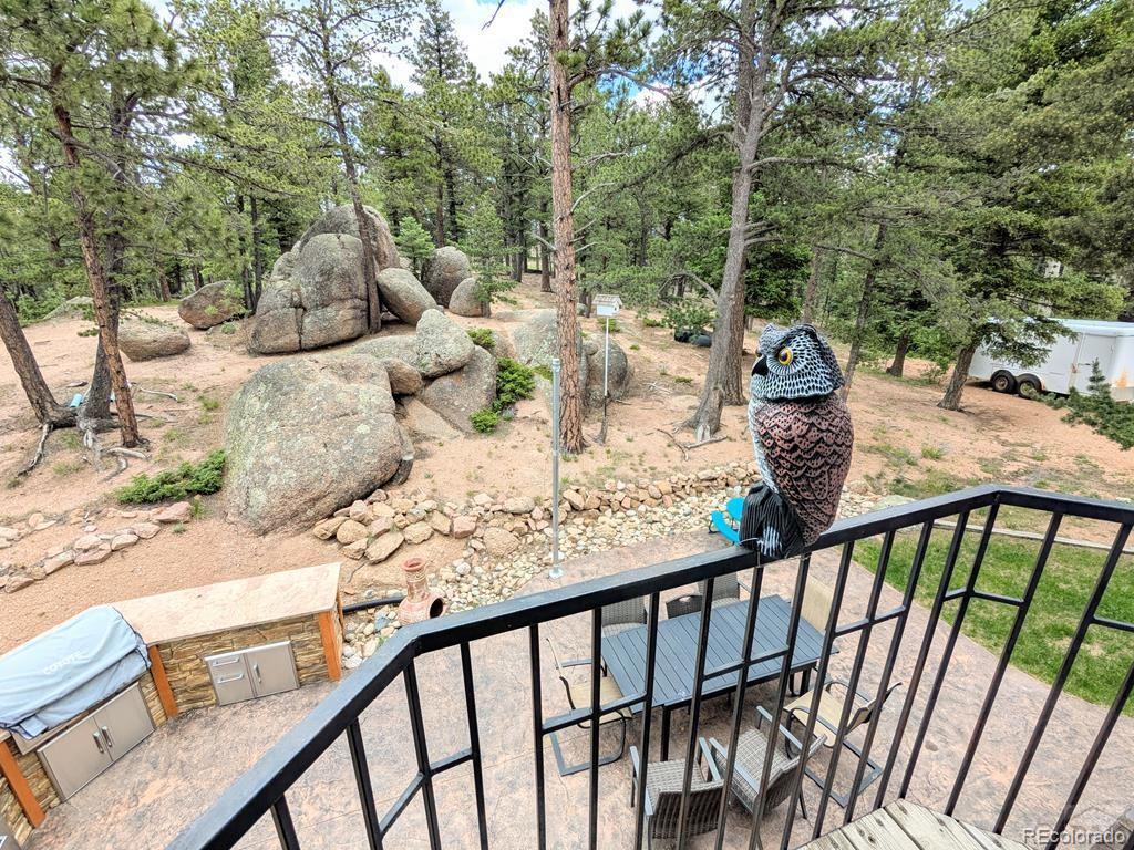10 Robert Road Rye, CO 81069 - Photo 25 of 50 a view of a balcony with wooden floor and outdoor seating