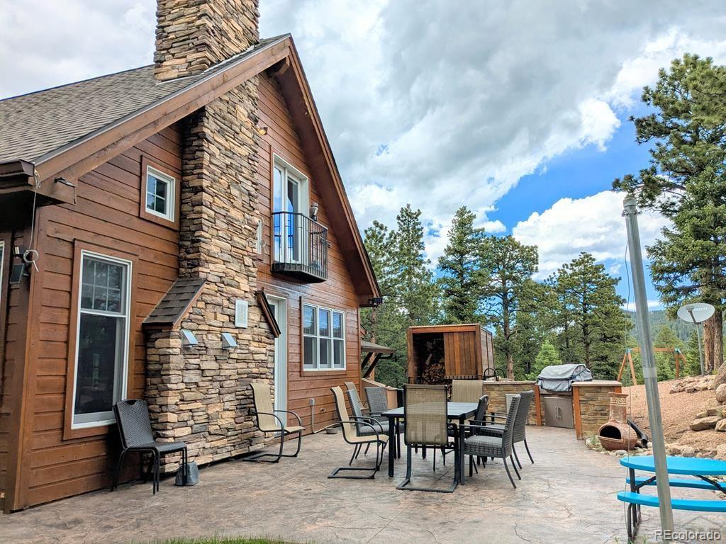 10 Robert Road Rye, CO 81069 - Photo 39 of 50 a view of deck with table and chairs and potted plants