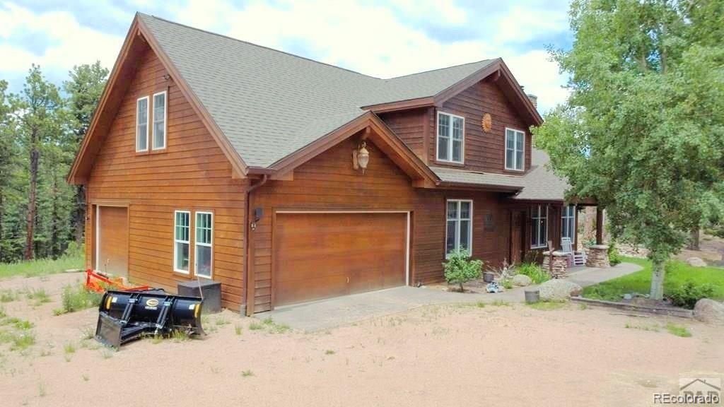 10 Robert Road Rye, CO 81069 - Photo 4 of 50 a front view of a house with a yard and garage