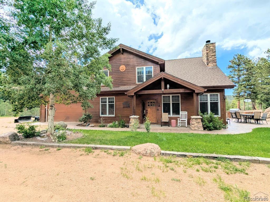 10 Robert Road Rye, CO 81069 - Photo 43 of 50 a front view of a house with a yard patio and fire pit