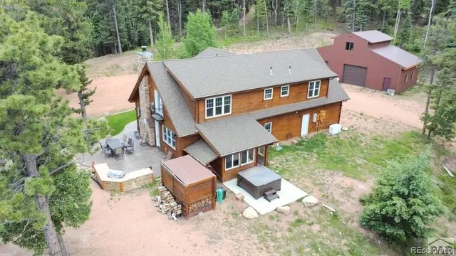 a living room with furniture kitchen view and a fireplace