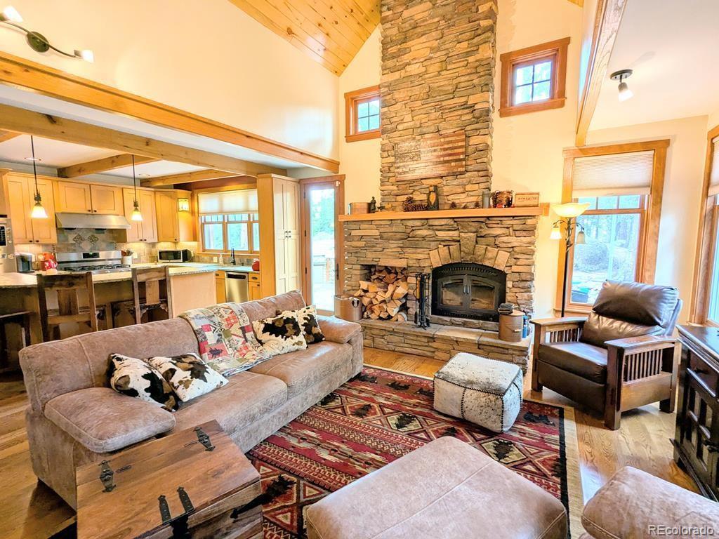 10 Robert Road Rye, CO 81069 - Photo 9 of 50 a living room with furniture kitchen view and a fireplace
