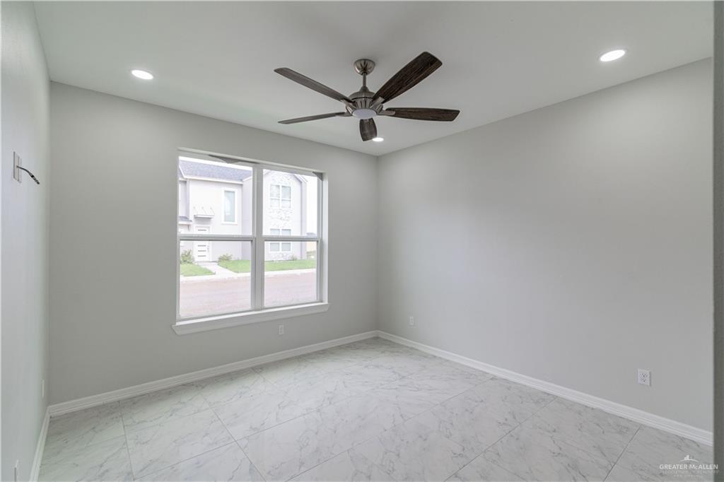 5404 North Crown Point Pharr, TX 78577 - Photo 12 of 24 an empty room with a window and a fan