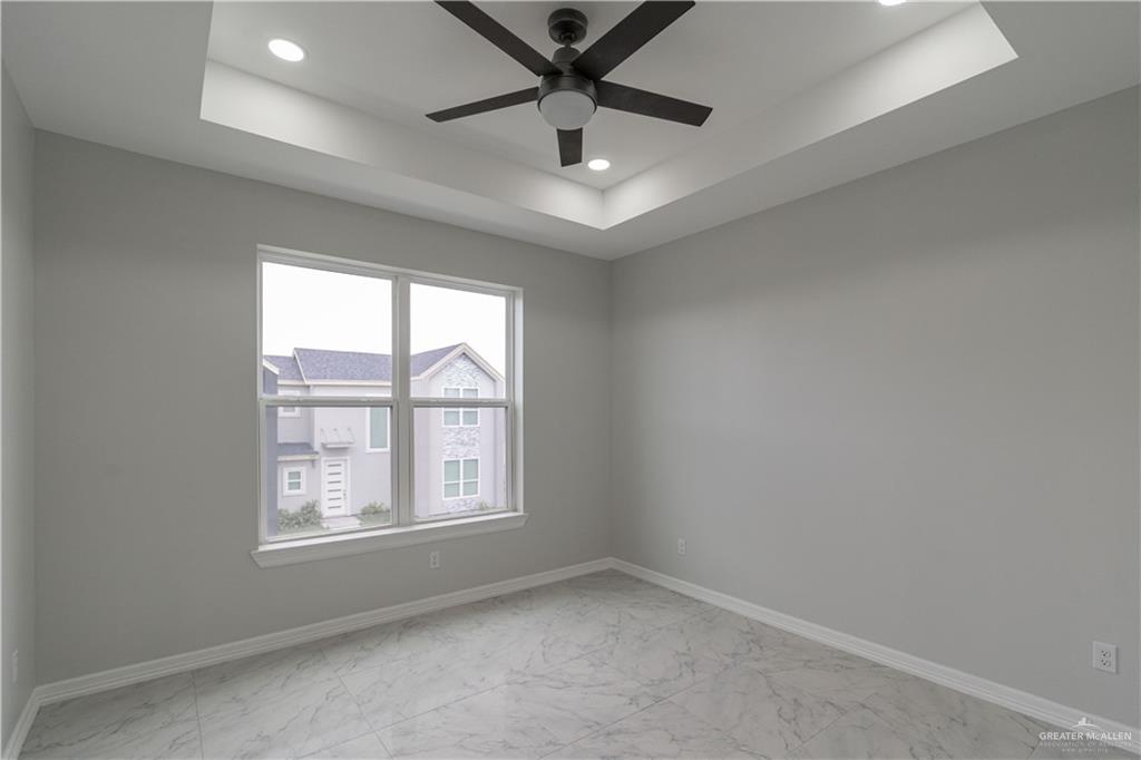 5404 North Crown Point Pharr, TX 78577 - Photo 14 of 24 an empty room with windows and ceiling fan