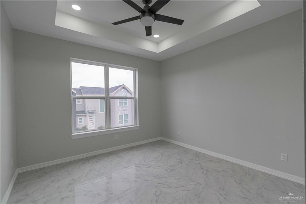 5404 North Crown Point Pharr, TX 78577 - Photo 15 of 24 an empty room with windows and ceiling fan