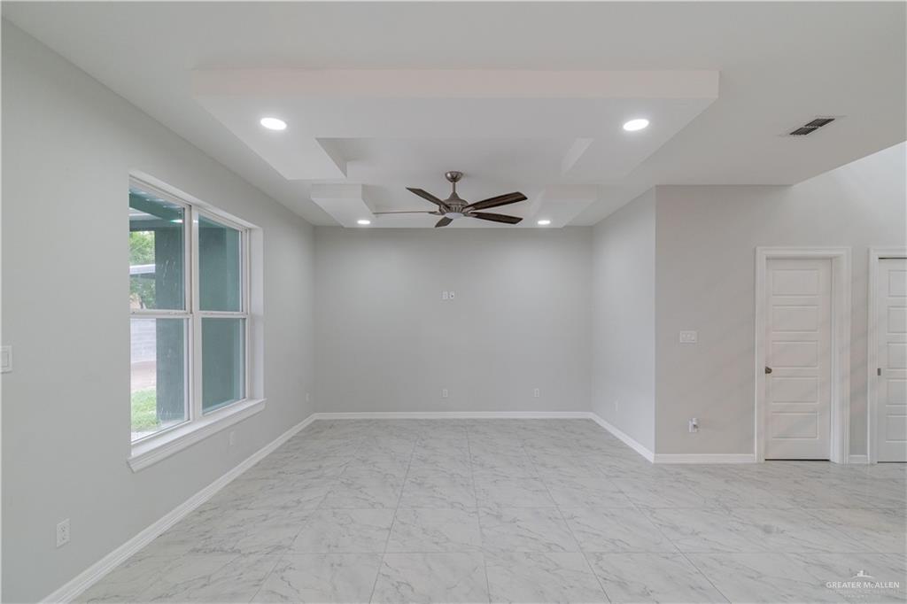 5404 North Crown Point Pharr, TX 78577 - Photo 10 of 24 an empty room with a window and a ceiling fan