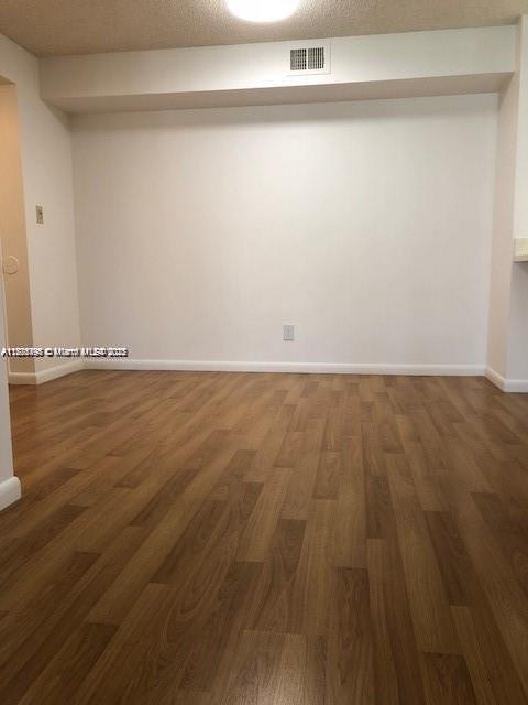 650 South Park Road, Unit 285 Hollywood, FL 33021 - Photo 6 of 13 a view of an empty room with wooden floor