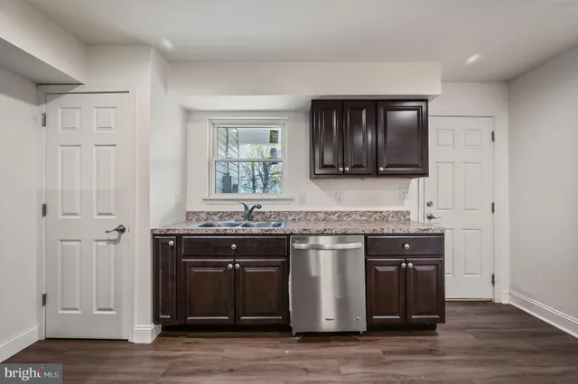 a kitchen with a sink and cabinets