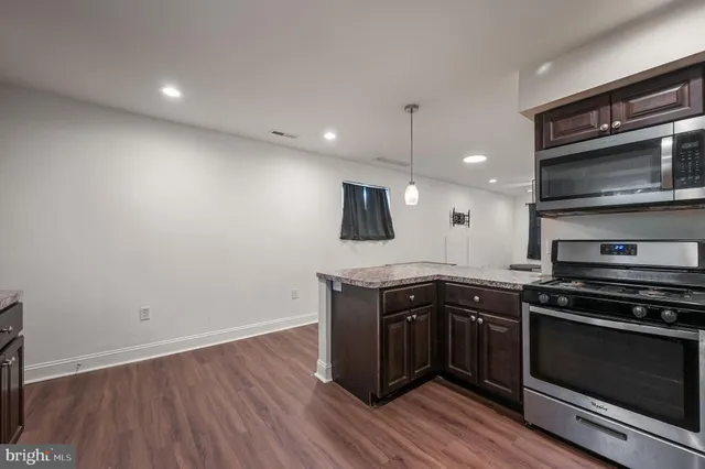 a kitchen with a stove and a microwave