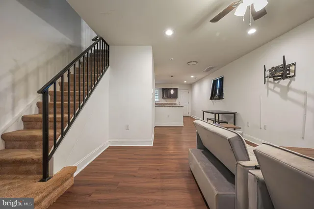 a view of a kitchen with furniture and staircase