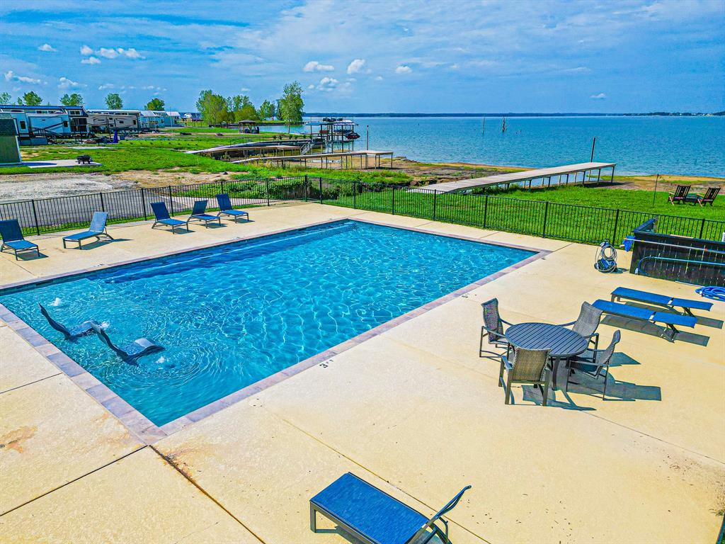 Lot 199 Peninsula Road Kerens, TX 75144 - Photo 15 of 26 a view of a swimming pool and lounge chairs