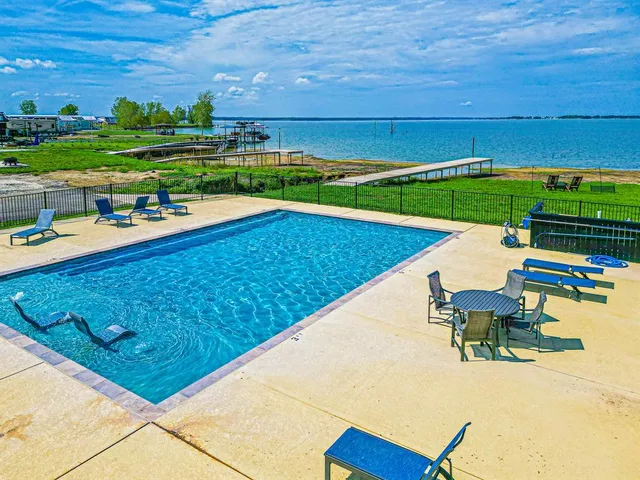 a view of a ocean with a lounge chairs