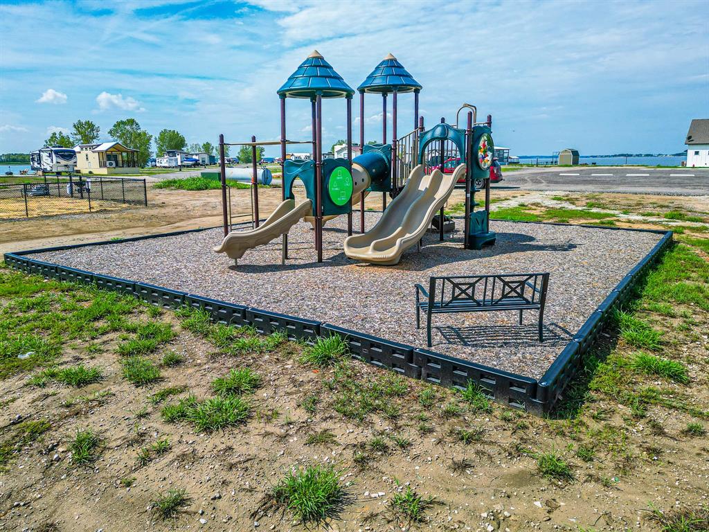 Lot 199 Peninsula Road Kerens, TX 75144 - Photo 19 of 26 a view of a park with a slide