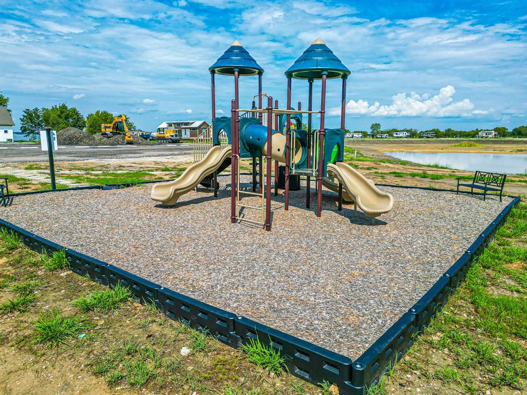 Lot 199 Peninsula Road Kerens, TX 75144 - Photo 20 of 26 swimming pool view with a garden space
