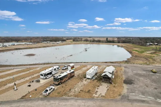 a view of house with garden space and sitting area