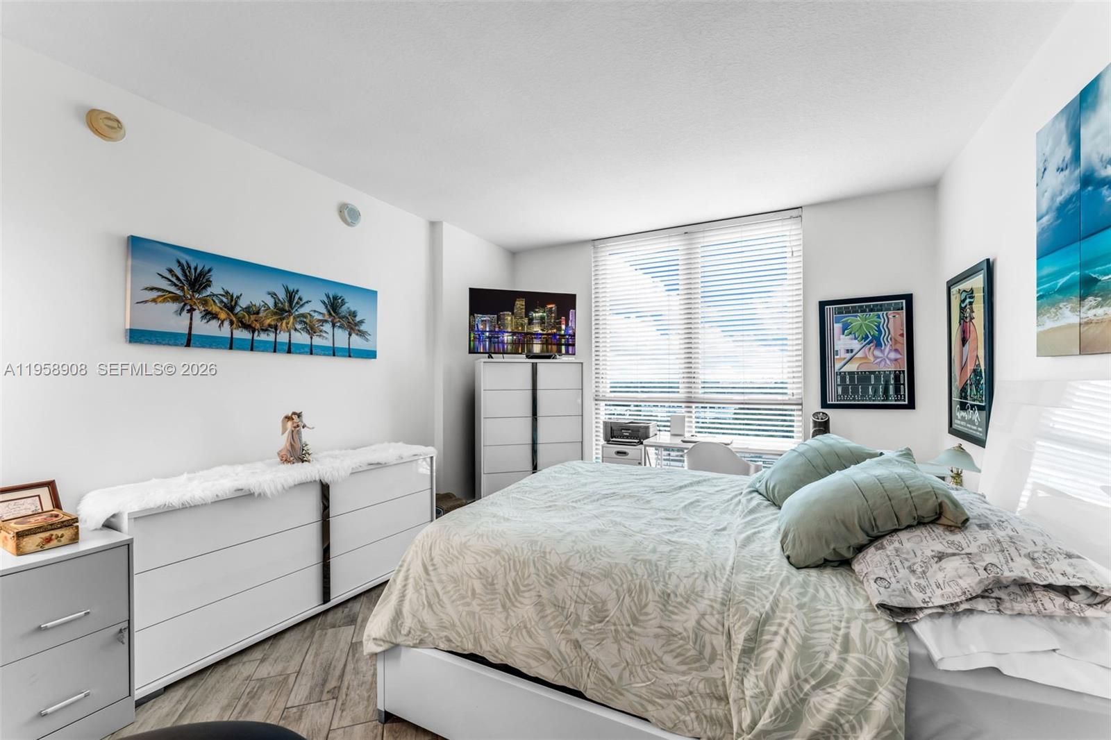 9066 Southwest 73rd Court, Unit 908 Miami, FL 33156 - Photo 14 of 46 a bedroom with a bed couch and window